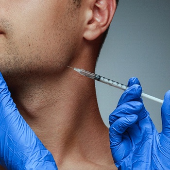 a dentist injection BOTOX into a patient’s jaw area