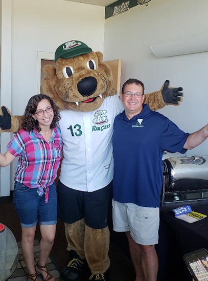 Two dental team members with sports mascot