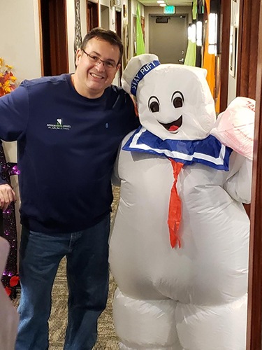 Dentist and person in stay puffed marshmallow man costume