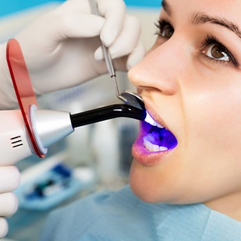 Patient receiving dental bonding treatment