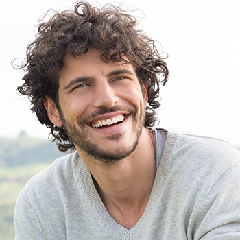 Man with healthy smile after periodontal therapy