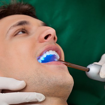 Patient receiving dental sealants