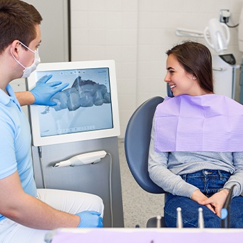 Dentist and patient looking at intraoral images