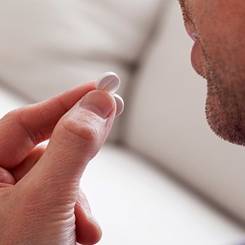 Patient taking an oral conscious dental sedation pill