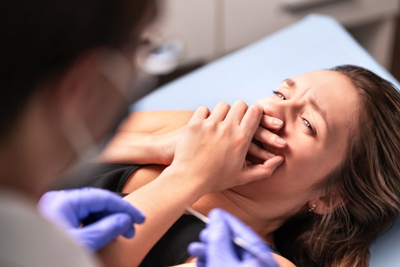 woman scared at the dentist in Dyer