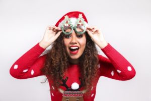 smiling woman wearing santa hat