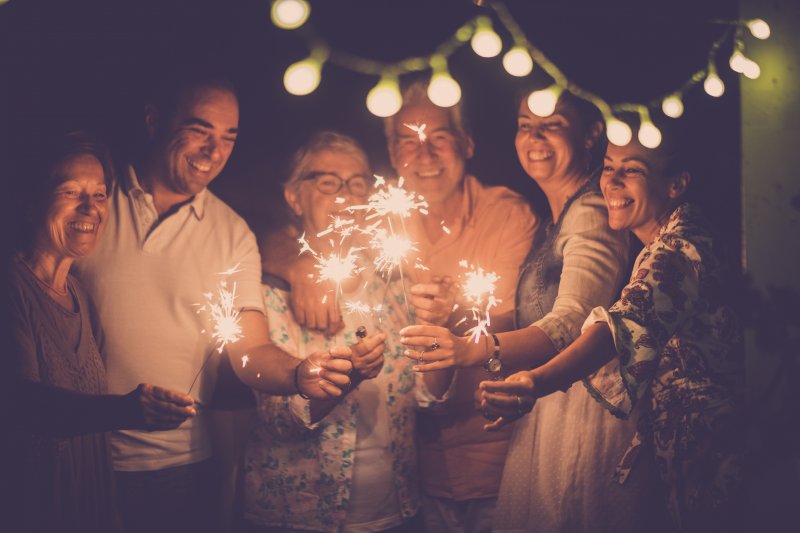 Multiple people with sparklers during the new year