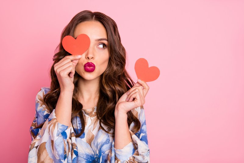 woman smiling on Valentine’s Day before visiting dentist in Dyer