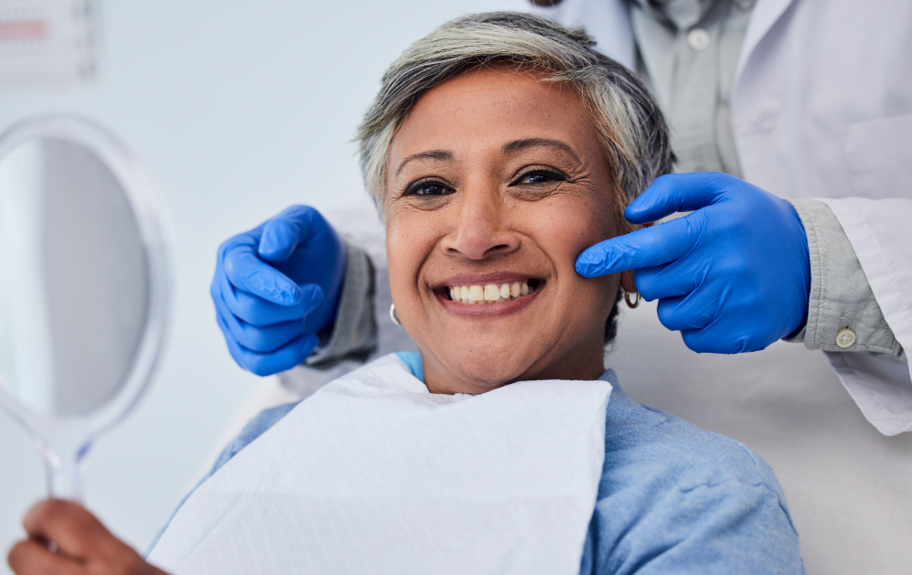 Woman smiling at a cosmetic dentistry appointment